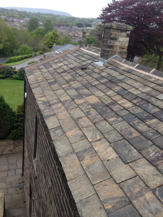 Stone roof repair and ridge tile replacement in Burnley Lancashire